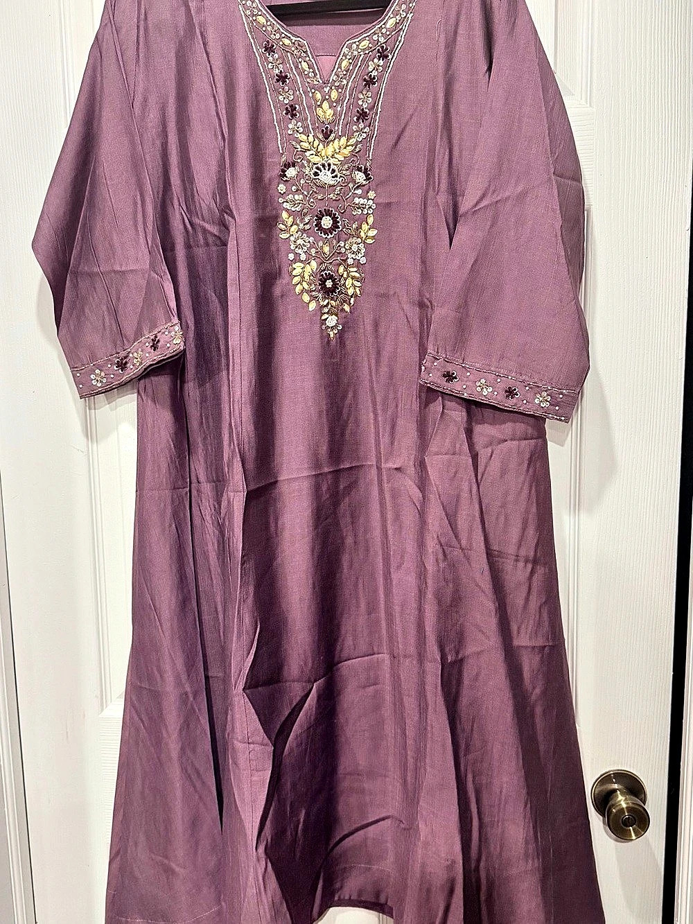 Pakistani mauve outfit with elegant embellishment on neck and sleeve